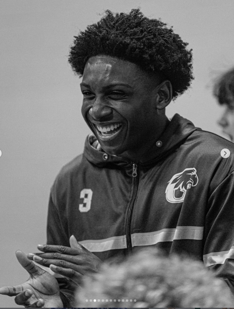 Harvest player smiling on the bench
